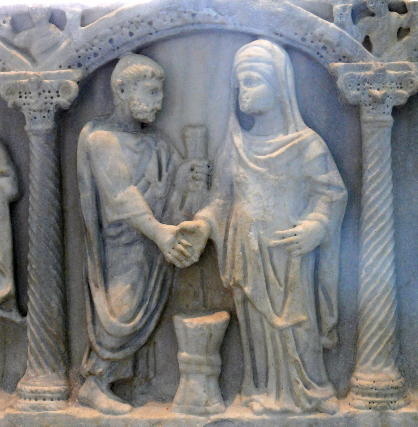 A late Roman sarcophagus relief with a couple clasping hands