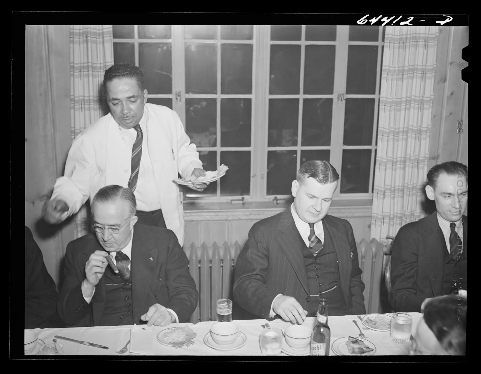 Men in suits seated at long banquet tables in a country club dining room, Portsmouth, Ohio, 1942