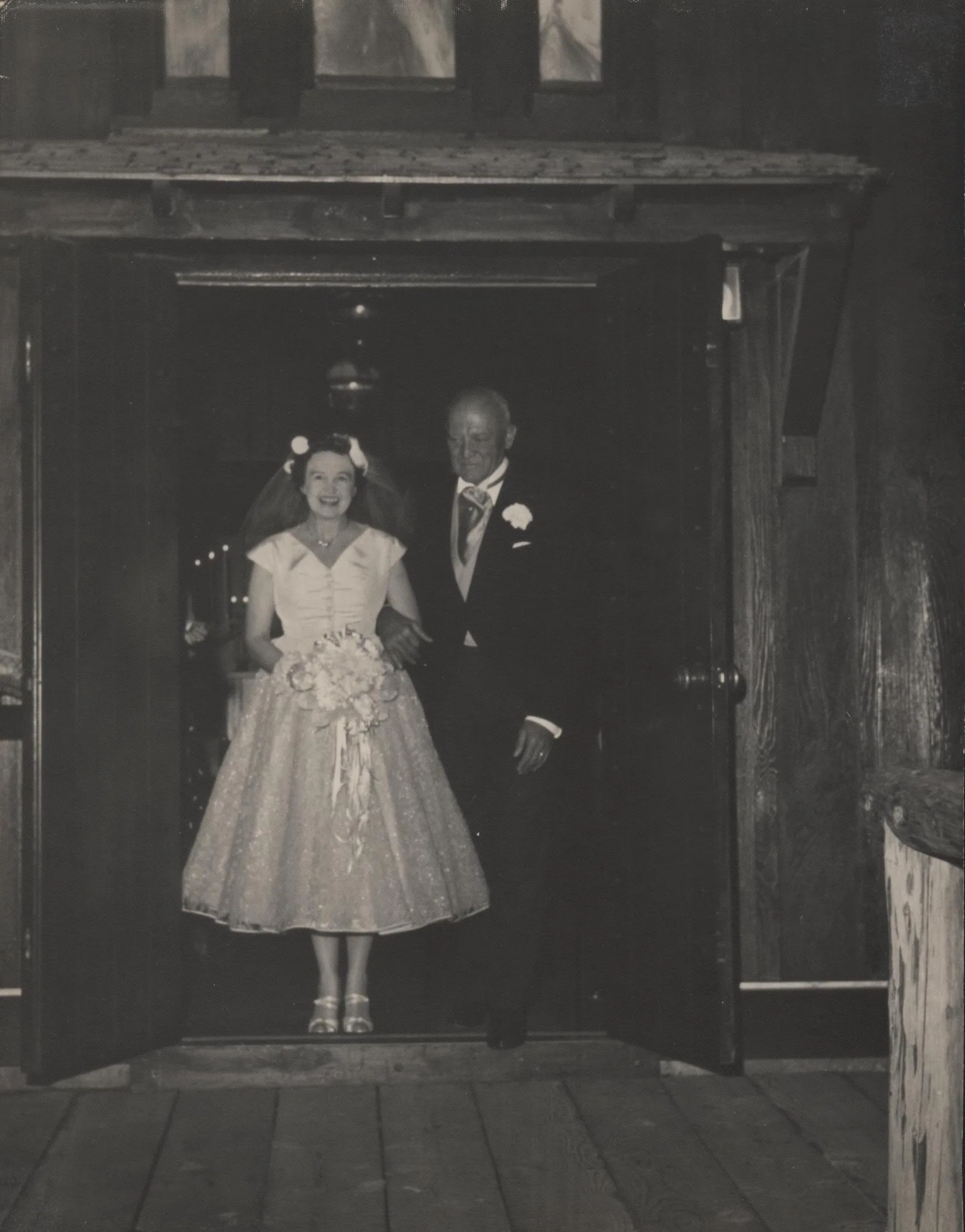 A bride and groom in uniform at a 1954 wedding